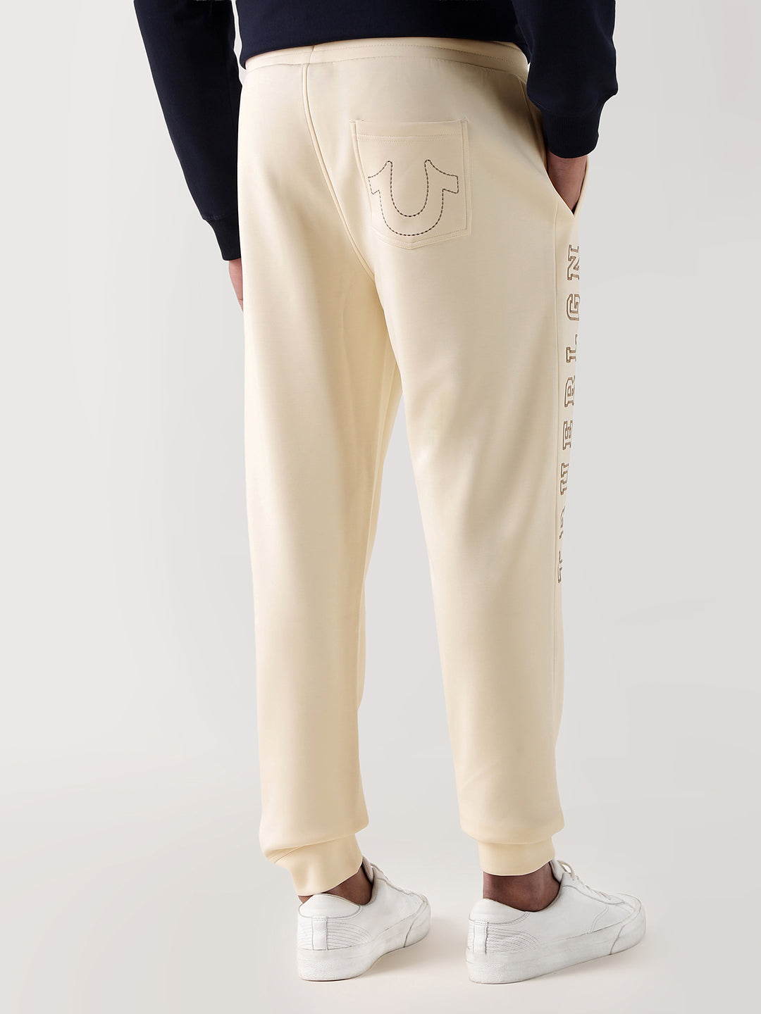 Men cream embroidered relaxed fit sweatpant